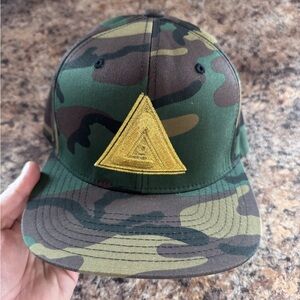 Camouflage Snapback Hat with Yellow Triangle Logo